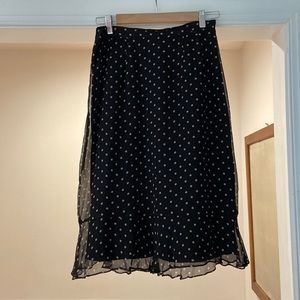 Size 6. Solid black under skirt with a sheer black & pink polkadots.